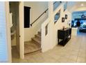 Carpeted staircase adjacent to the foyer, leading to the upper level at 10077 Cooper Mountain St, Las Vegas, NV 89141