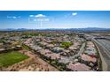 Scenic aerial shot overlooking a neighborhood, with the Las Vegas Strip visible in the distance at 10809 Garden Mist Dr # 2050, Las Vegas, NV 89135