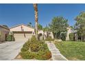 Charming single-story home features a well-manicured lawn, desert landscaping, and inviting entrance at 11540 Snow Creek Ave, Las Vegas, NV 89135