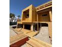 Exterior view of new construction highlighting foundation work and wood framing of a modern home at 1764 Amarone Way, Henderson, NV 89012