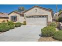 Inviting home featuring a two-car garage and low-maintenance landscaping at 2534 Starlight Valley St, Henderson, NV 89044