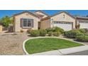 Attractive single-story home showcasing a manicured front lawn and desert landscaping at 2534 Starlight Valley St, Henderson, NV 89044
