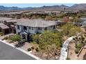 Bird's eye view of the stunning home surrounded by manicured landscaping and lush greenery at 257 Elder View Dr, Las Vegas, NV 89138