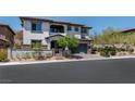 Elegant two-story house boasts an inviting entrance and attached two car garage at 257 Elder View Dr, Las Vegas, NV 89138