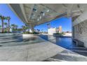 Daytime view of the covered entrance with modern architectural design and stone accents at Sky Las Vegas at 2700 Las Vegas Blvd # 3501, Las Vegas, NV 89109