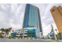 Modern high-rise building featuring sleek architecture, blue glass accents, and surrounding streetscape at 2700 Las Vegas Blvd # 3501, Las Vegas, NV 89109