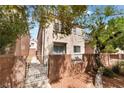 Charming backyard area with a brick fence and space for outdoor seating at 3103 Sunrise Cove Ave, North Las Vegas, NV 89031