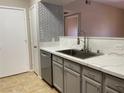 This kitchen features stainless appliances, stone countertops, and a tile backsplash at 45 Maleena Mesa St # 1113, Henderson, NV 89074