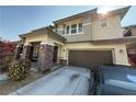 Charming two-story home boasting stone accents, a covered porch, and a convenient two-car garage at 5615 Oak Bend Dr, Las Vegas, NV 89135