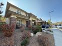 Well-maintained home with a covered porch, stone pillars, and desert landscaping for easy upkeep at 5615 Oak Bend Dr, Las Vegas, NV 89135