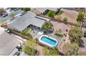 Backyard aerial view features a sparkling pool, patio, and desert landscape at 5892 Castleberry Peak Ave, Las Vegas, NV 89131
