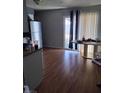 Bright dining area with sliding glass doors and wood-look flooring at 609 Marcella Ave, North Las Vegas, NV 89030