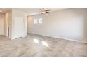 Spacious living area features tile floors and neutral walls at 6164 Violet Falls St # 44, North Las Vegas, NV 89081