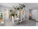 Elegant dining room boasts unique floral decor, creating a sophisticated and inviting space at 6620 Macdoogle St, Las Vegas, NV 89166