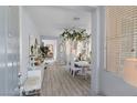Bright entryway leads to dining area with lots of natural light and an open-concept layout at 6620 Macdoogle St, Las Vegas, NV 89166