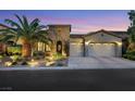Charming single-Gathering home with manicured landscaping, stone accents, and a three-car garage at dusk at 7181 Barton Creek Ct, Las Vegas, NV 89113