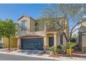 Charming two-story home featuring a blue garage door and a second-story balcony at 9066 Hilverson Ave, Las Vegas, NV 89148