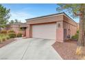 View of the home's front, showcasing the two-car garage, driveway, and low maintenance landscaping at , Las Vegas, NV 89144