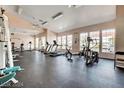 Well-equipped gym with treadmills, bikes, weight machines, and large windows for natural light at 2725 S Nellis Blvd # 2083, Las Vegas, NV 89121