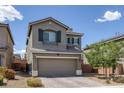 Attractive two-story home featuring a large two-car garage and desert landscaping at 5589 Pico Ferrera Ct, Las Vegas, NV 89113