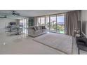 Open living space with balcony access and a cozy seating arrangement at 205 E Harmon Ave # 803, Las Vegas, NV 89169