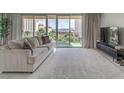 Bright living room featuring a large balcony with sweeping city views at 205 E Harmon Ave # 803, Las Vegas, NV 89169