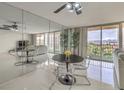 Bright living room featuring tile floors, mirrored wall, and a dining area with city views at 205 E Harmon Ave # 803, Las Vegas, NV 89169