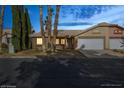 Lovely single-story home with desert landscaping, two car garage and mature trees at 254 Reber Dr, Mesquite, NV 89027