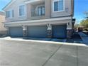 Inviting home featuring a three-car garage and a charming second-story balcony at 6045 Riverwalk Falls St # 102, North Las Vegas, NV 89031