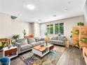 Bright living room with large windows, comfortable seating, and stylish decor at 8701 Giant Causeway Ave, Las Vegas, NV 89148