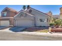 Charming single story home featuring a desert landscape and two car garage at 109 Clifton Heights Dr, Las Vegas, NV 89145