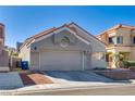 Charming single story home featuring a desert landscape and two car garage at 109 Clifton Heights Dr, Las Vegas, NV 89145
