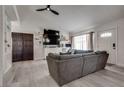 Stylish living room with sleek flooring, comfortable sofa, and mounted flat screen at 109 Clifton Heights Dr, Las Vegas, NV 89145