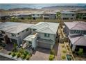 Aerial view of a new home in a modern housing development with a neutral color palette at 12495 Point Sierra St, Las Vegas, NV 89138