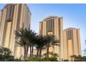 Luxury high-rise buildings showcasing modern architecture and lush palm trees, offering a premium residential experience at 125 E Harmon Ave # 2215, Las Vegas, NV 89109