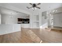 A spacious living room offering wood-look floors and an open floorplan at 2612 Kindness Ct, North Las Vegas, NV 89031