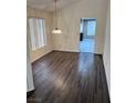 Cozy dining room with wood floors and large windows, perfect for Gathering meals at 3324 Haven Beach Way, Las Vegas, NV 89117