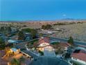 Wide aerial view of the property showcasing the home's landscaping and surrounding desert environment at 4061 W Eldorado Ln, Las Vegas, NV 89139