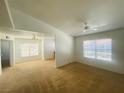 Spacious living room featuring neutral paint, ceiling fan and plush carpeting, perfect for relaxation at 45 Maleena Mesa St # 1321, Henderson, NV 89074