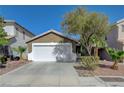 Charming single Gathering home with a well-maintained front yard and a two-car garage in a suburban neighborhood at 5438 Jacobs Field St, Las Vegas, NV 89148