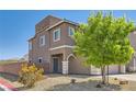 View of the side exterior showcasing the desert landscaping and proximity to the street at 5556 Cornadelo Range Rd, Las Vegas, NV 89113
