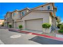 Row of garages at the townhome, complete with individual unit numbers and 'No Parking Fire Lane' signage at 5730 Sky Pointe Dr # 104, Las Vegas, NV 89130