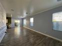Spacious living room featuring tiled floors, decorative walls, recessed lighting, and sliding glass doors to the backyard at 5846 Lee Fairy Ct, Las Vegas, NV 89139