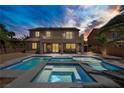 Resort-style backyard featuring a pristine pool, spa, and a covered patio for relaxing at 6489 Crest Estates St, Las Vegas, NV 89131