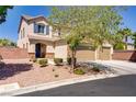 Beautiful two-story home with a three-car garage, desert landscaping, and inviting curb appeal at 6489 Crest Estates St, Las Vegas, NV 89131