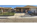 Charming single-story home featuring a gated front yard and covered parking at 7047 Mountain Meadow Ln, Las Vegas, NV 89147