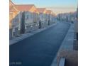 Exterior street view of townhouse community featuring attached garages and well-kept facades at 8787 Tom Noon Ave # 101, Las Vegas, NV 89178