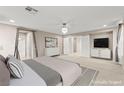 Spacious main bedroom with plush carpet and access to ensuite bath at 9277 Ardoa Ave, Las Vegas, NV 89148