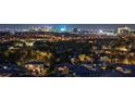 Panoramic nighttime view of the dazzling Las Vegas skyline from a residential neighborhood at 10 Olympia Outlook Dr, Las Vegas, NV 89141