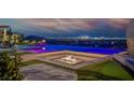 Infinity pool with a built-in fire pit and city views, creating a luxurious outdoor space at 10 Olympia Outlook Dr, Las Vegas, NV 89141
